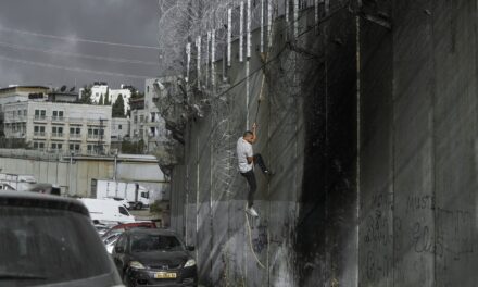 Palestinians in West Bank risk crossing Israel’s separation barrier to flee failing economy