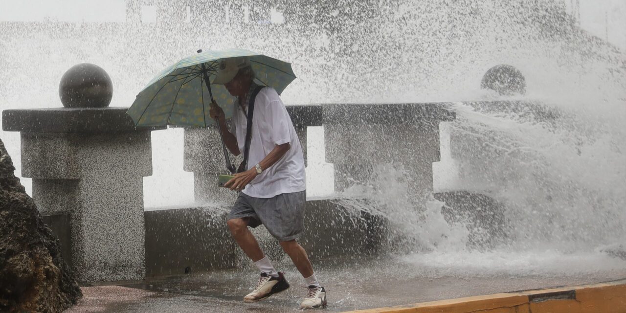 Typhoon bringing heavy rain slowly heads toward Taiwan, where 4,000 have evacuated