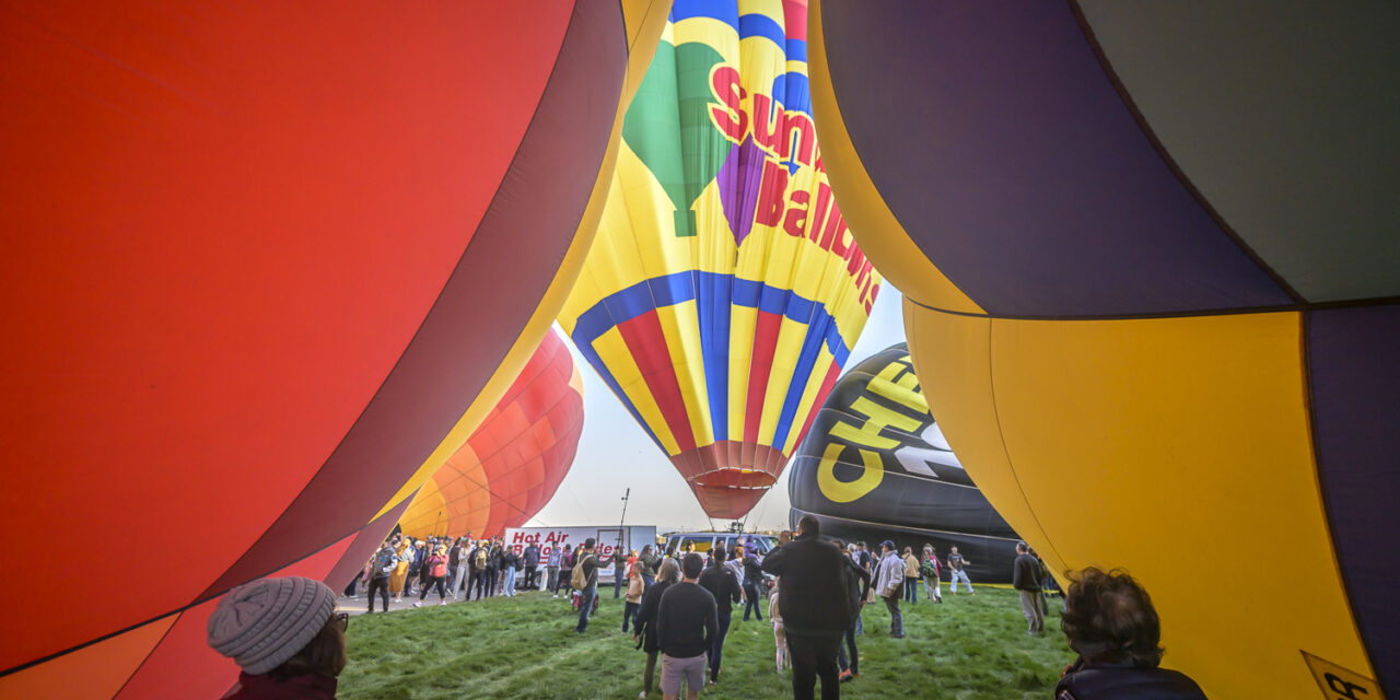 ‘Magical’ flotilla of hot air balloons take flight at international fiesta amid warm temperatures