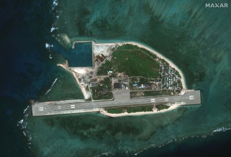 Exclusive-Chinese ships gather near island disputed with Philippines, satellite images show