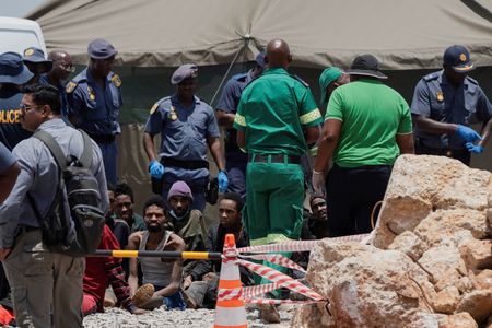 South Africa pulls 36 corpses from illegal mine, arrests 82 survivors