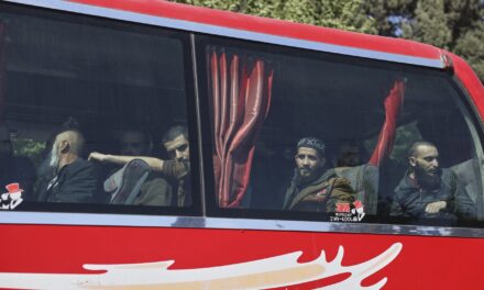 Syrian government and Kurdish-led force exchange prisoners in a step toward easing tensions