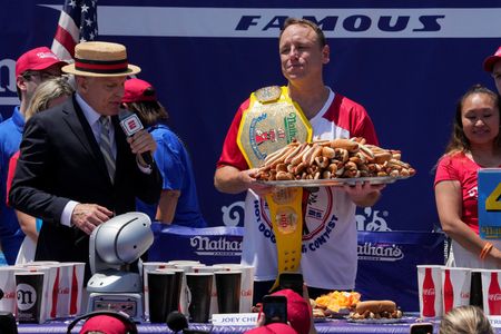 Longtime champion Joey Chestnut downs 71 hot dogs to reclaim title