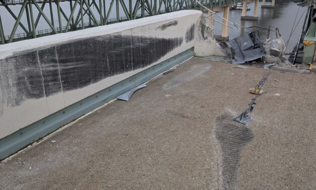 Truck smashes through barrier and plunges off a bridge into the Delaware River