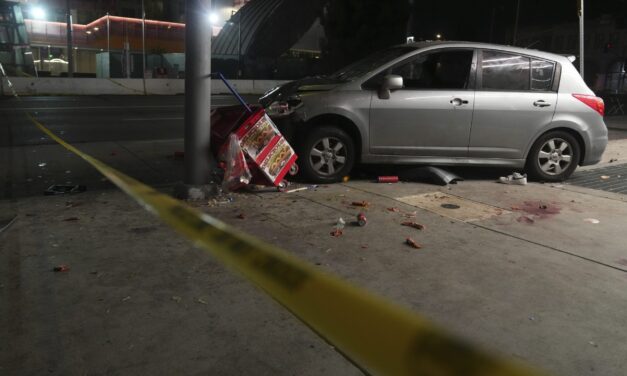 Man whose car struck crowd outside Los Angeles club, injuring 30, was shot, attacked by crowd